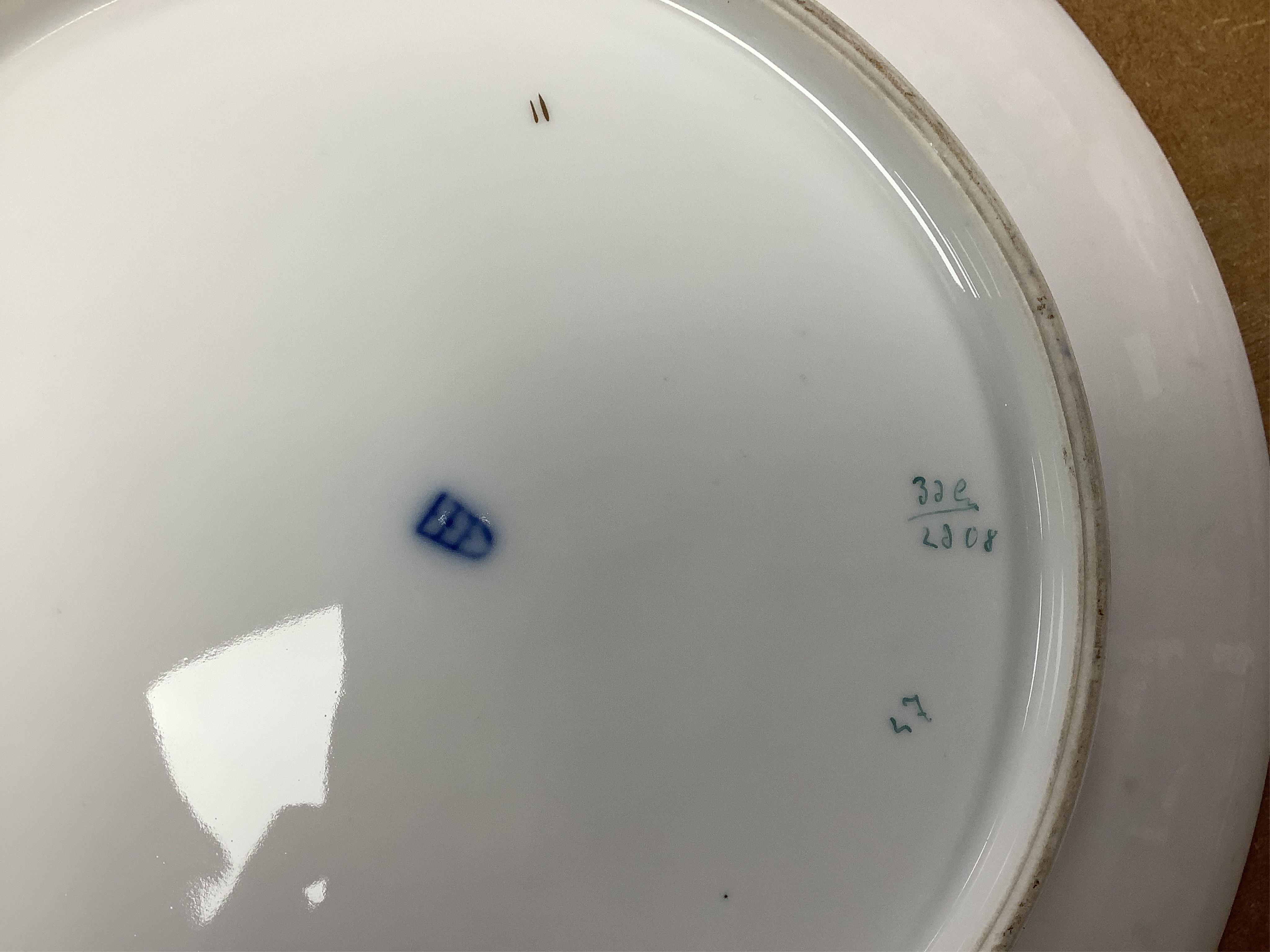 A pair of Vienna style porcelain chargers, early 20th century, 33cm